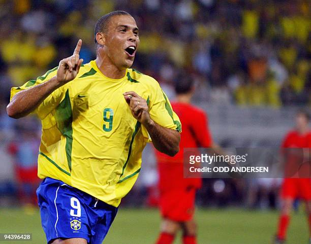 Brazilian forward Ronaldo celebrates after he scored during the second round match Brazil/Belgium of the 2002 FIFA World Cup in Korea and Japan, 17...