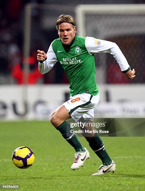 Clemens Fritz of Bremen runs with the ball during the Bundesliga match between Werder Bremen and FC Schalke 04 at the Weser stadium on December 12,...