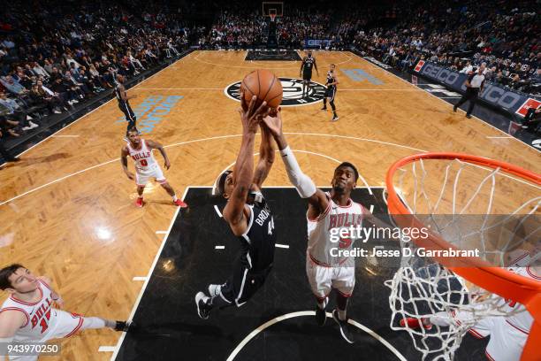 Dante Cunningham of the Brooklyn Nets shoots the ball against Bobby Portis of the Chicago Bulls during the game between the two teams on April 9,...