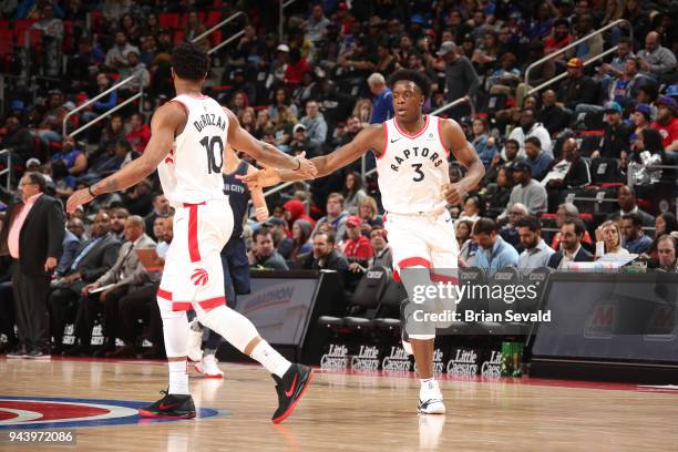 DeMar DeRozan of the Toronto Raptors and OG Anunoby of the Toronto Raptors high five during the game against the Detroit Pistons on April 9, 2018 at...