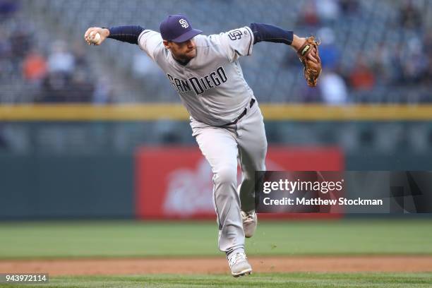 Third baseman Chase Headley of the San Diego Padres fields a ground ball off the bat of DJ LeMahieu of the Colorado Rockies in the first inning at...