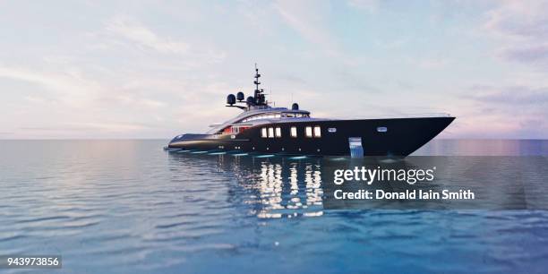 luxury super yacht in calm sea at dusk - luxury yachts stock-fotos und bilder