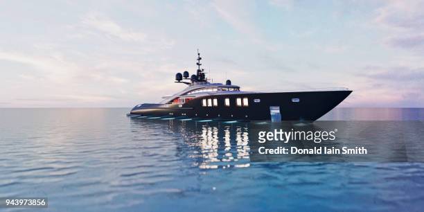 luxury super yacht in calm sea at dusk - luxury yachts stockfoto's en -beelden