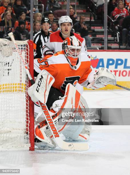 Brian Elliott of the Philadelphia Flyers prepares to stop a shot on goal against Sebastian Aho of the Carolina Hurricanes on April 5, 2018 at the...