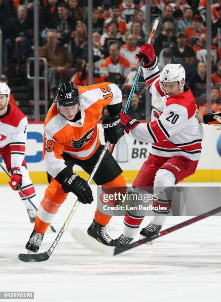 Sebastian Aho of the Carolina Hurricanes battles against Nolan Patrick of the Philadelphia Flyers on April 5, 2018 at the Wells Fargo Center in...