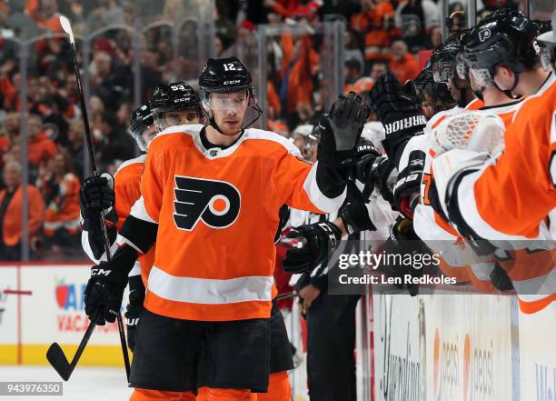 Michael Raffl of the Philadelphia Flyers celebrates Claude Giroux's third period goal with teammates against the Carolina Hurricanes on April 5, 2018...