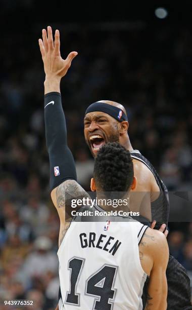 Vince Carter of the Sacramento Kings yells out instruction in front of Danny Green of the San Antonio Spurs at AT&T Center on April 9 , 2018 in San...
