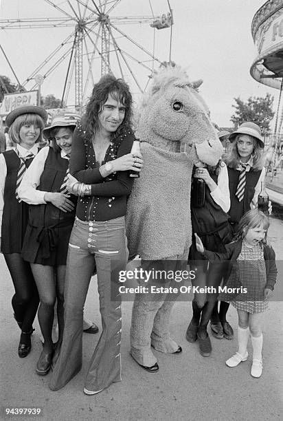 American rock singer Alice Cooper with an eclectic group of friends, 1977.