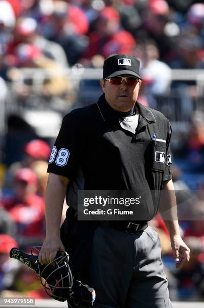 Umpire Doug Eddings watches the game between the Washington Nationals and the New York Mets during the home opener at Nationals Park on April 5, 2018...