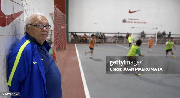 Argentinian football talent scout Ramon Maddoni stands next to boys playing indoor footbal at Club Parque in Buenos Aires on March 22, 2018. -...