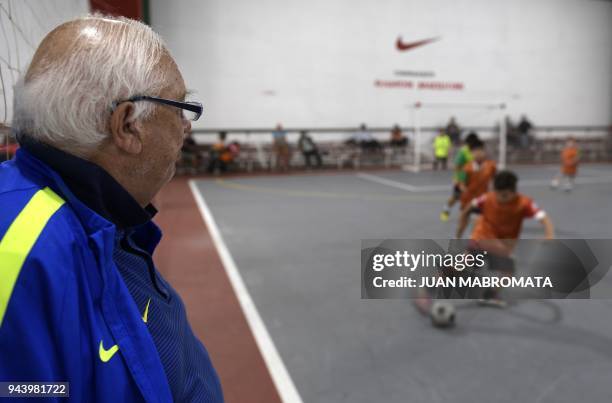 Argentinian football talent scout Ramon Maddoni watches boys playing indoor footbal at Club Parque in Buenos Aires on March 22, 2018. - Maddoni is a...