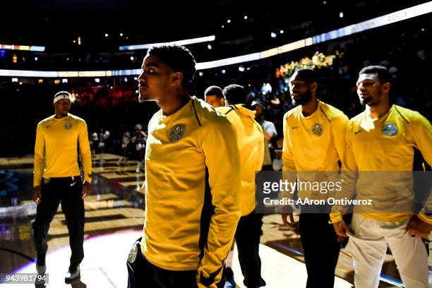 Gary Harris of the Denver Nuggets stands with teammates before the first half against the Portland Trail Blazers on Monday, April 9, 2018.