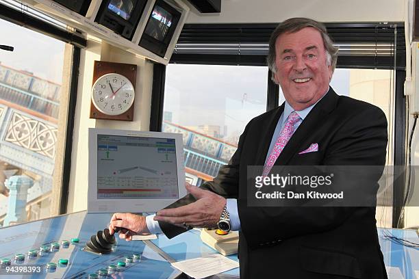Sir Terry Wogan poses for a picture inside the control tower on Tower Bridge on December 14, 2009 in London, England. Sir Terry was invited to raise...