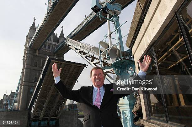 Sir Terry Wogan poses for a picture on London's Tower Bridge on December 14, 2009 in London, England. Sir Terry was invited to raise the bridge after...
