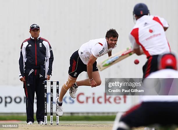 James Anderson of England bowls as England Coach Andy Flower looks on during an England Nets Session at the High Performance Centre at the University...