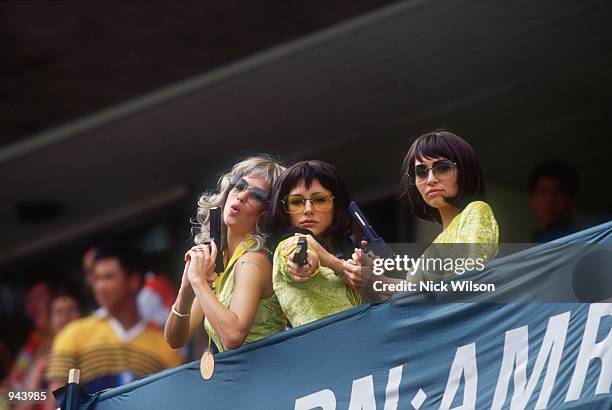 Fans dress up as ''Charlies Angels'' during the IRB World Sevens Series 2001 Hong Kong Sevens tournament held at the Hong Kong Stadium, in Hong Kong....