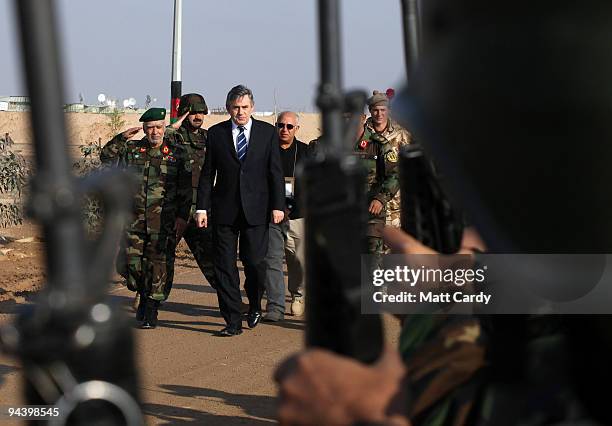 Prime Minister Gordon Brown arrives to meet British and Afghan troops at the Shorabak training camp on December 13, 2009 near Camp Bastion,...