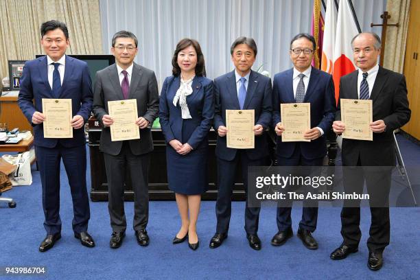 Rakuten Inc. Chairman and CEO Hiroshi Mikitani receives an approval certificate to offer mobile services from Minister of Internal Affairs and...