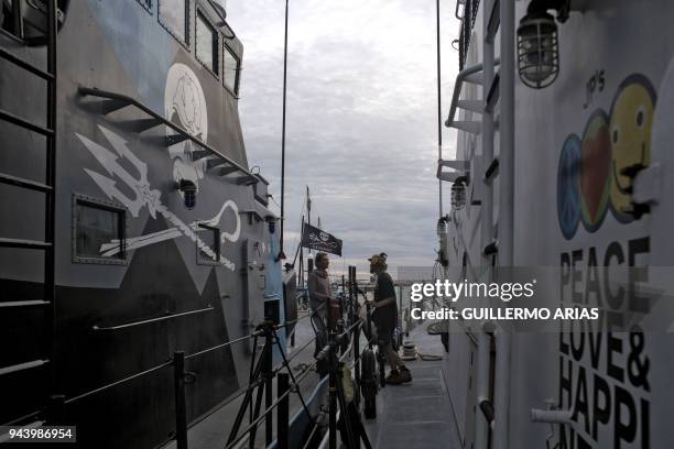 John Paul Dejoria and M/V Farley Mowat crew members talk as the ships remain docked at the port of San Felipe, in the Gulf of California, Baja...