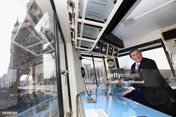 Sir Terry Wogan operates the controls inside the control tower on Tower Bridge on December 14, 2009 in London, England. Sir Terry was invited to...