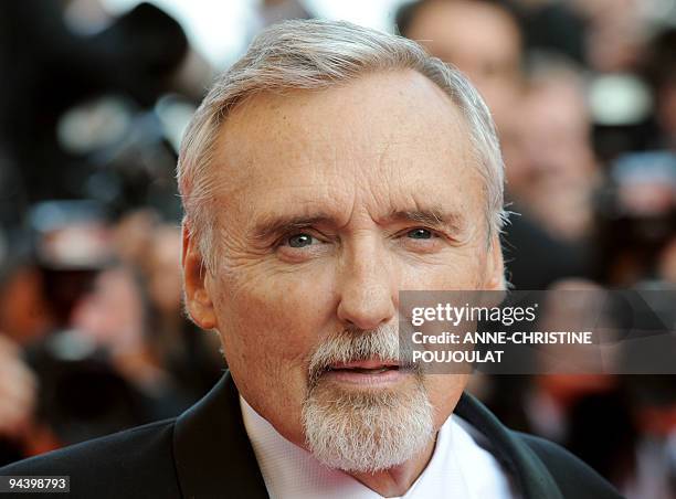 Actor and director Dennis Hopper poses as he arrives to attend the opening ceremony and the screening of Brazilian director Fernando Meirelles' film...