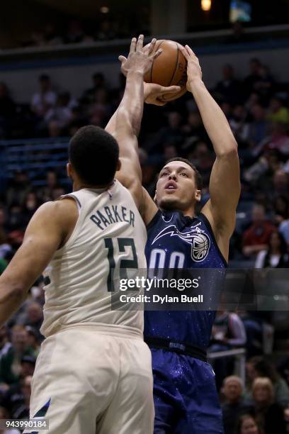 Aaron Gordon of the Orlando Magic attempts a shot while being guarded by Jabari Parker of the Milwaukee Bucks in the third quarter at the Bradley...