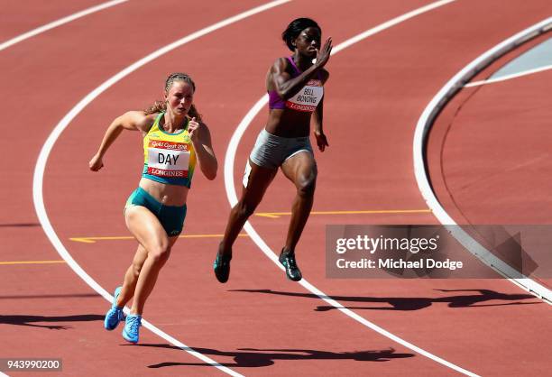 Riley Day of Australia and Irene Bell Bonong of Cameroon compete in the Women's 200 metres heats during the Athletics on day six of the Gold Coast...