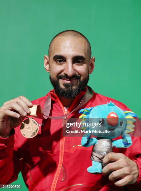 Bronze medalist Ali Jawad of England poses during the medal ceremony for the Para Powerlifting on day six of the Gold Coast 2018 Commonwealth Games...