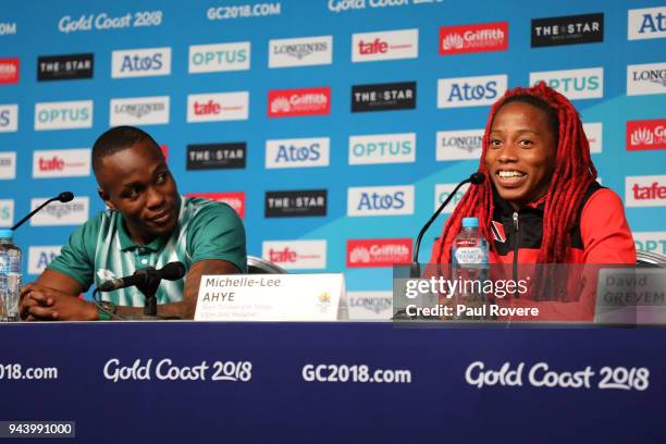 Men's 100m gold medallist Akani Simbine of South Africa and Women's 100m gold medallist Michelle-Lee Ahye of Trinidad and Tobago are seen during a...