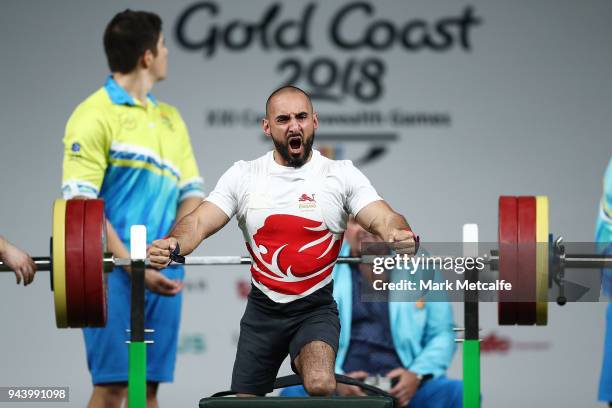 Ali Jawad of England celebrates a lift in the Men's Lightweight Final during the Para Powerlifting on day six of the Gold Coast 2018 Commonwealth...