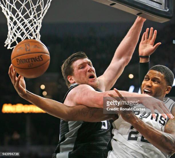Rudy Gay of the San Antonio Spurs is fouled by Jack Cooley of the Sacramento Kings as he drives to the basket at AT&T Center on April 9 , 2018 in San...