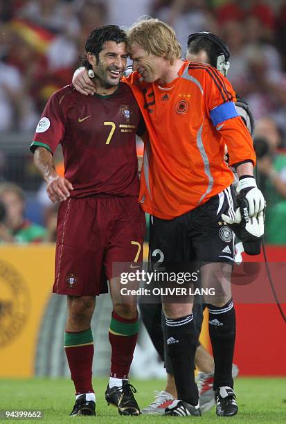 German goalkeeper Oliver Kahn and Portuguese forward Luis Figo share a moment at the end of the third-place playoff 2006 World Cup football match...