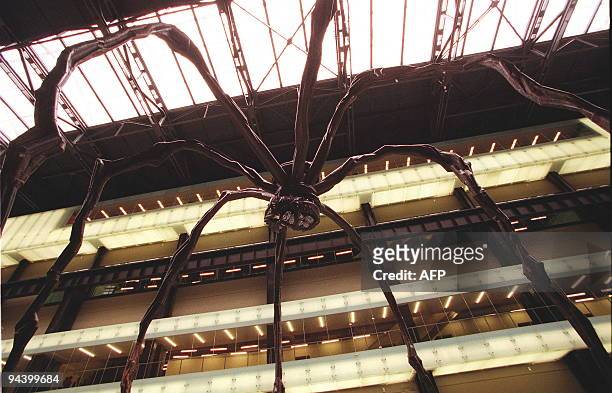 Paris born artist Louise Bourgeois's second display in the new Tate Modern entitled "Maman" is a giant female spider constructed in steel standing 30...