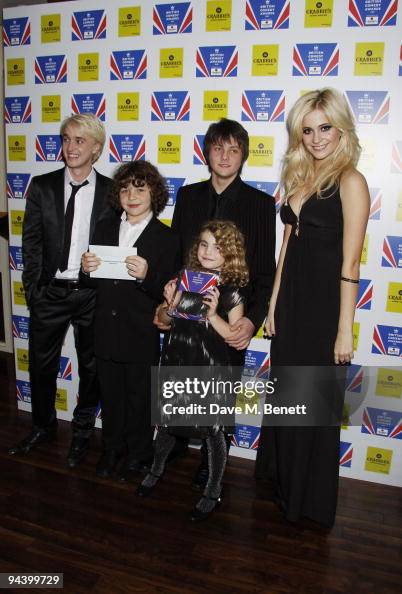 Actor Daniel Roche poses with the best sitcom trophy with co stars ...