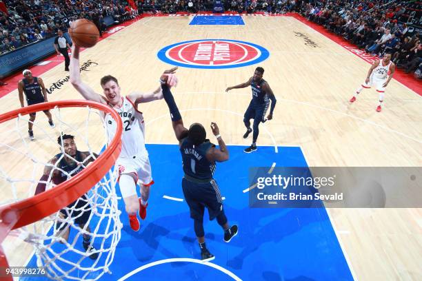 Jakob Poeltl of the Toronto Raptors goes to the basket against the Detroit Pistons on April 9, 2018 at Little Caesars Arena in Detroit, Michigan....