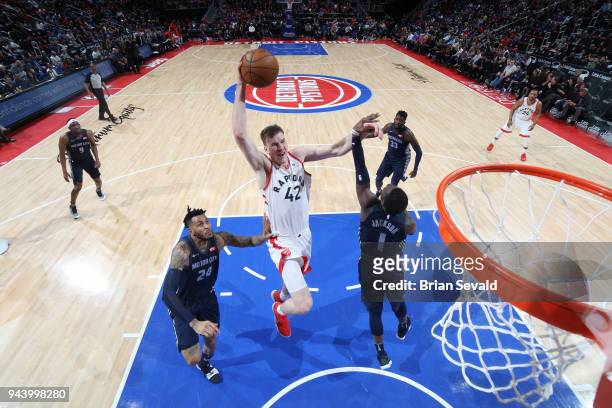 Jakob Poeltl of the Toronto Raptors goes to the basket against the Detroit Pistons on April 9, 2018 at Little Caesars Arena in Detroit, Michigan....