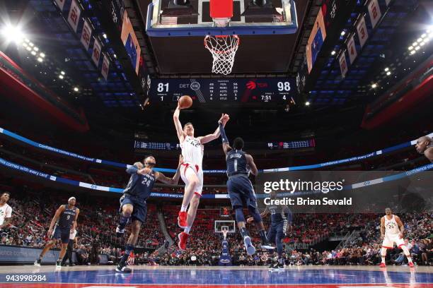 Jakob Poeltl of the Toronto Raptors goes to the basket against the Detroit Pistons on April 9, 2018 at Little Caesars Arena in Detroit, Michigan....