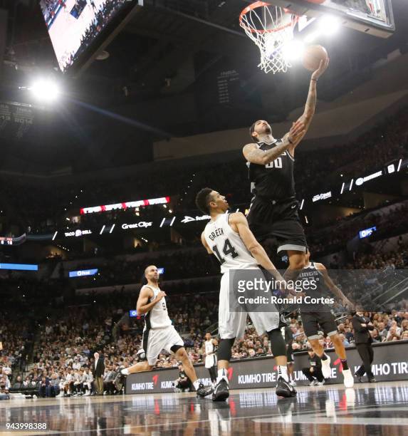Willie Cauley-Stein of the Sacramento Kings scores in front of Danny Green of the San Antonio Spurs at AT&T Center on April 9 , 2018 in San Antonio,...