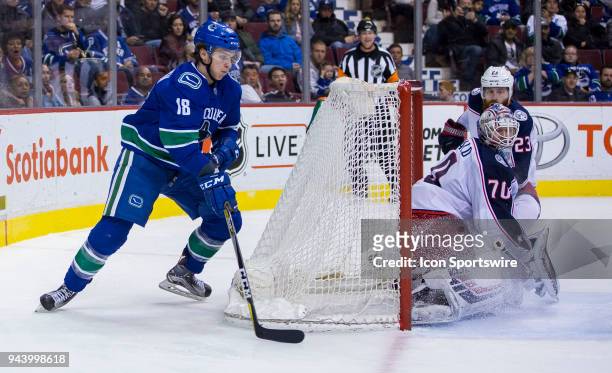 Vancouver Canucks Right Wing Jake Virtanen tries a wrap around shot on Columbus Blue Jackets Goalie Joonas Korpisalo during the third period in a NHL...