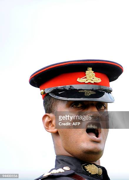 Sri Lankan special forces take part in a ceremony commemorating the victory over Tamil Tiger rebels at army headquarters in Colombo on December 14,...