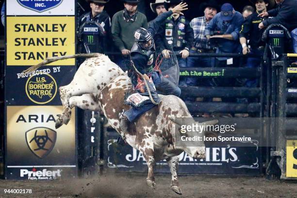 Claudio Montanha Jr. Rides bull Sitting Bull during Championship round of the 25th Professional Bull Riders Unleash The Beast, on April 8 at Denny...