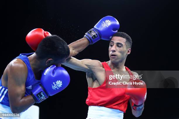 Galal Yafai of England and Sharvin Kumar Beedassee of Mauritius compete in the Men's 46-49kg Quarterfinal during Boxing on day six of the Gold Coast...