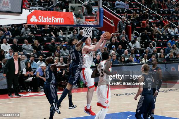 Jakob Poeltl of the Toronto Raptors handles the ball against the Detroit Pistons on April 9, 2018 at Little Caesars Arena in Detroit, Michigan. NOTE...