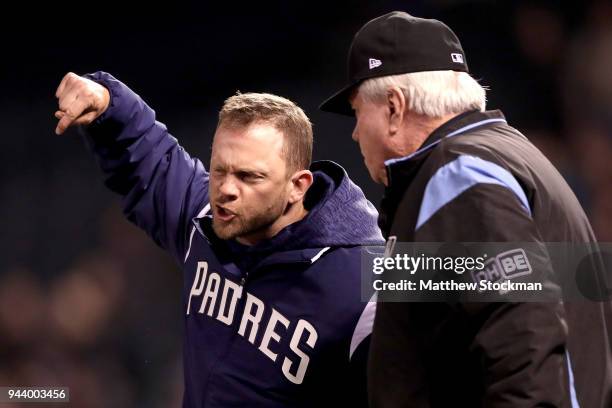 Manager Andy Green of the San Diego Padres disputes a home run call with umpire Brian Gorman in the sixth inning against the Colorado Rockies at...