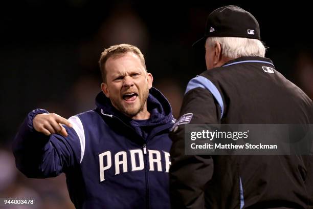 Manager Andy Green of the San Diego Padres disputes a home run call with umpire Brian Gorman in the sixth inning against the Colorado Rockies at...