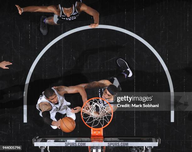LaMarcus Aldridge of the San Antonio Spurs dunks against Willie Cauley-Stein of the Sacramento Kings on April 9, 2018 at the AT&T Center in San...