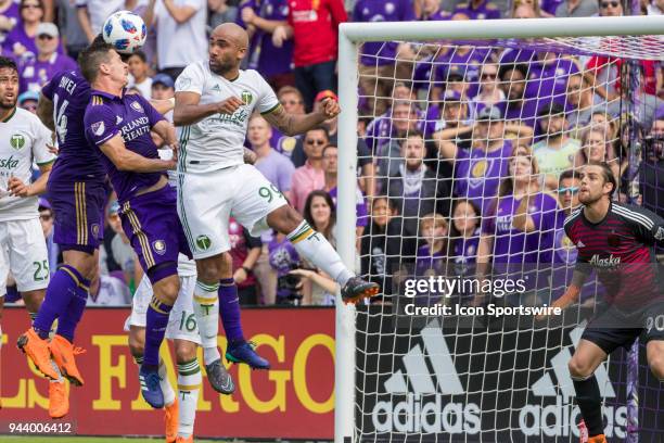 Orlando City forward Dom Dwyer , Orlando City midfielder Will Johnson and Portland Timbers forward Samuel Armenteros go up for a header during the...