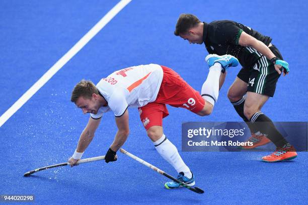 David Goodfield of England and Hywel Jones of Wales competes for the ball during the Hockey Men's Pool B match between England and Wales on day six...