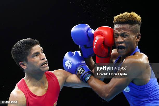 Jonas Jonas of Namibia and Dinindu Ponnawela Vidanalage Doncompete of Sri Lanka compete in the Men's 64kg Quarterfinal Boxing on day six of the Gold...