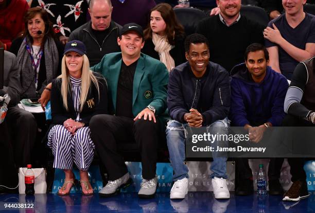 Justine Karain Reed, Patrick Reed, Chris Rock and Aziz Ansari attend New York Knicks Vs Cleveland Cavaliers at Madison Square Garden on April 9, 2018...